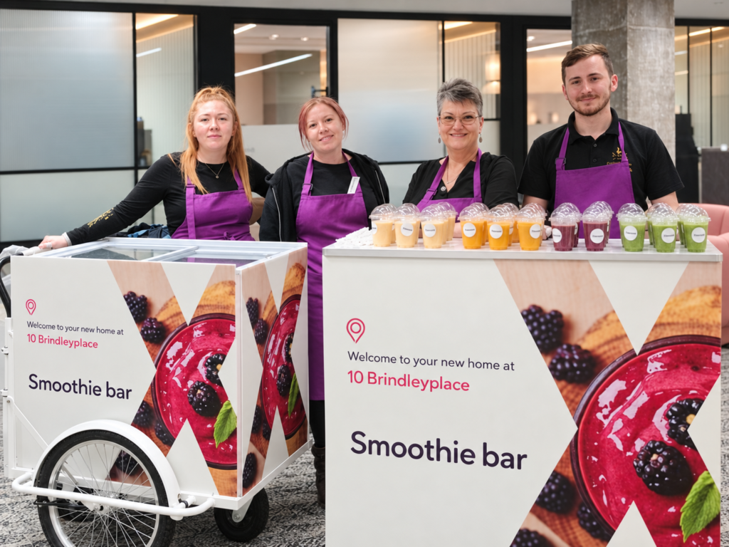 Our catering team serving smoothies at a corporate event